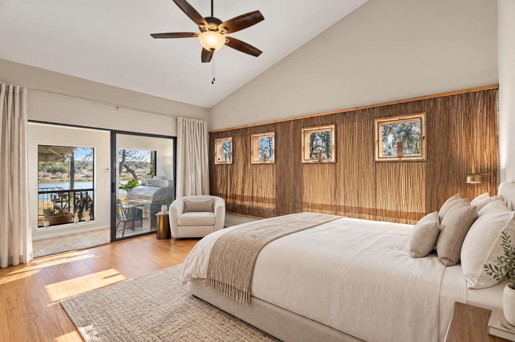 Guest bedroom with a chair, bench, and a large woven rug